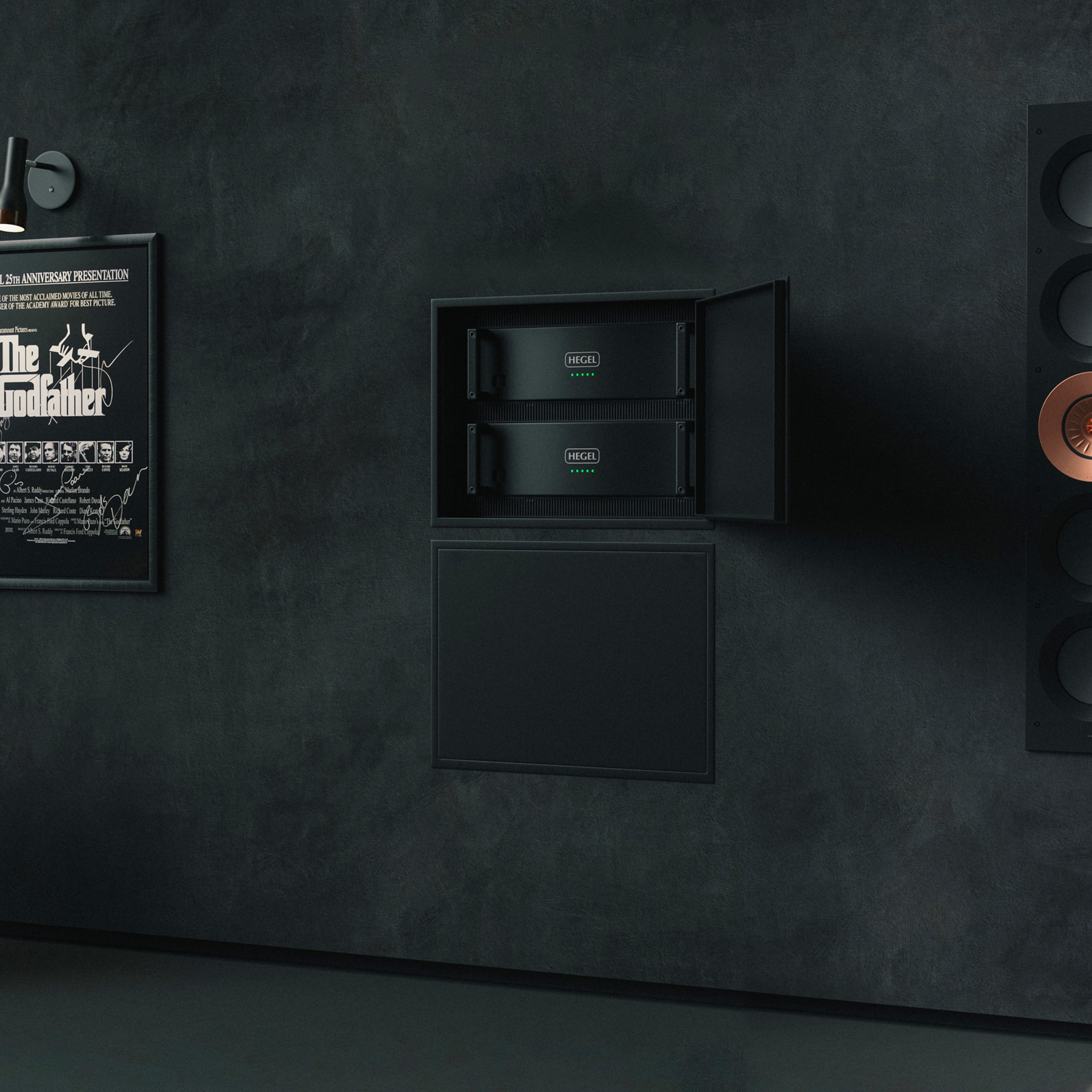 Dark wall with a framed poster of 'The Godfather' and built-in rack of Hegel C5 Series amplifiers.