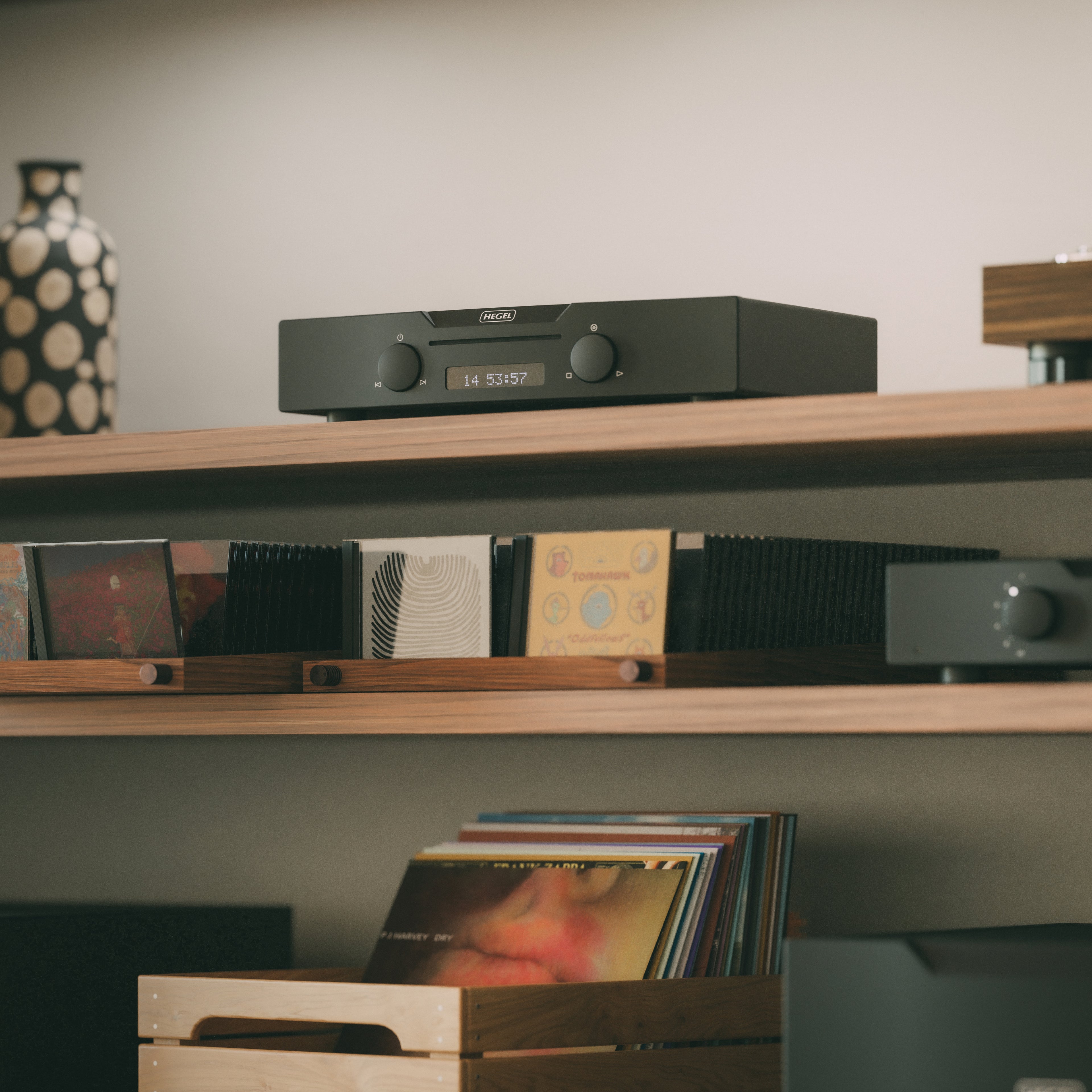 Black Hegel Viking CD Player on a shelf with records below