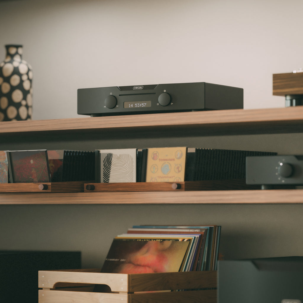Black Hegel Viking CD Player on a shelf with records below