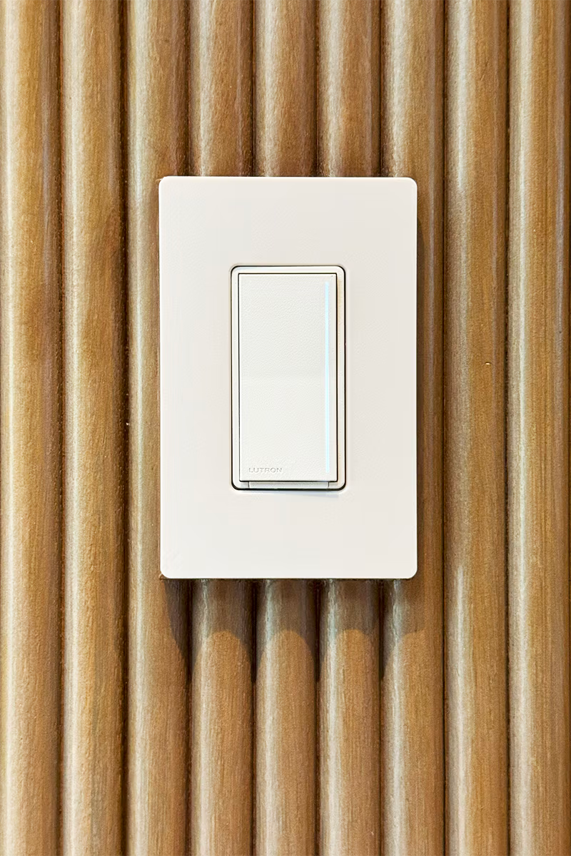 Lutron Light switch on a wooden wall
