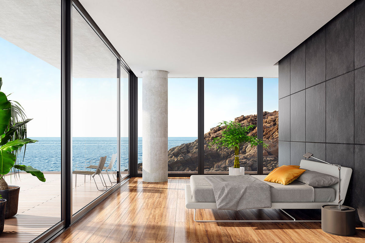 Modern bedroom with ocean view and large windows