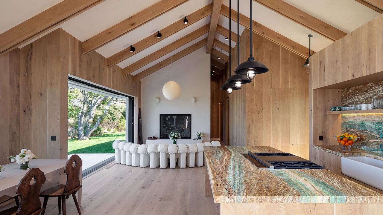 Modern farmhouse great room with beautiful green and gold marble countertop